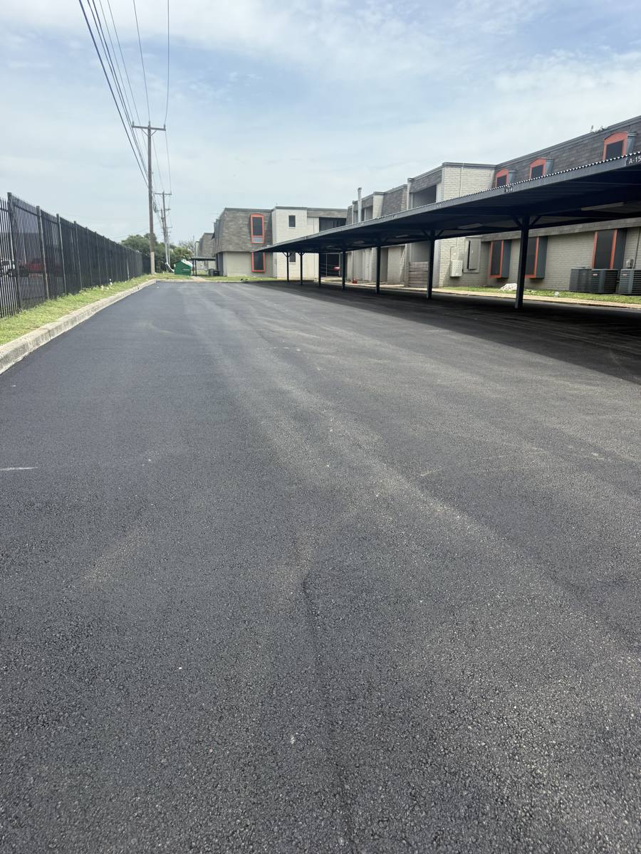 Long apartment parking lot, freshly paved