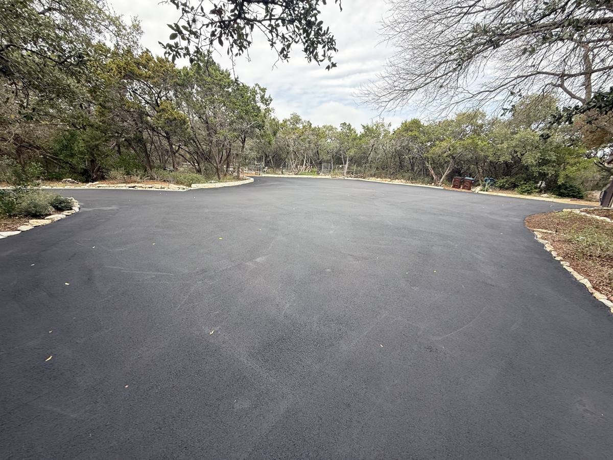 Large asphalt turnaround in front of a home