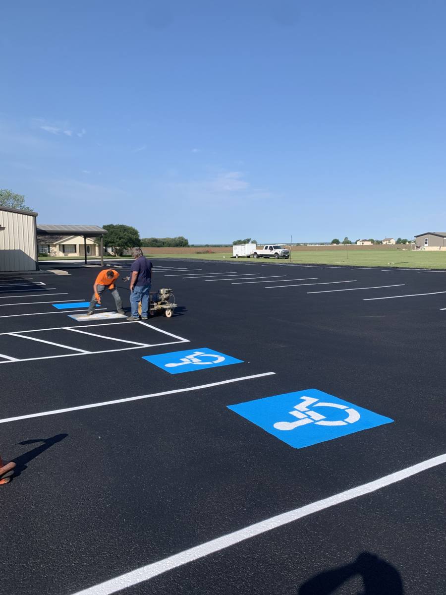 New parking lot striping with ADA stalls