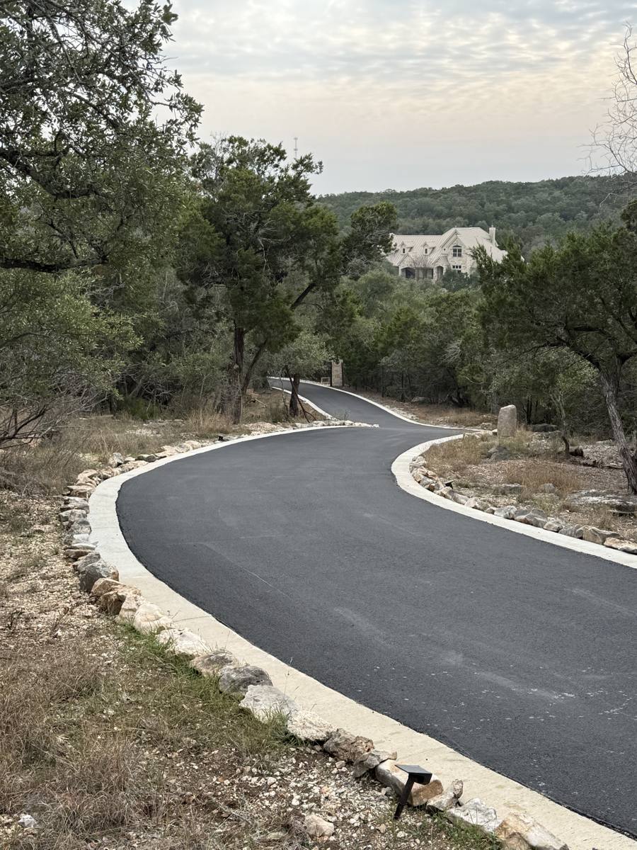 Winding Hill Country driveway with curbing